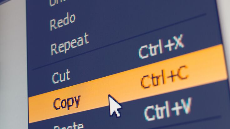 © eranicle - stock.adobe.com Software menu item with copy command highlighted and mouse cursor selected it, macro shot